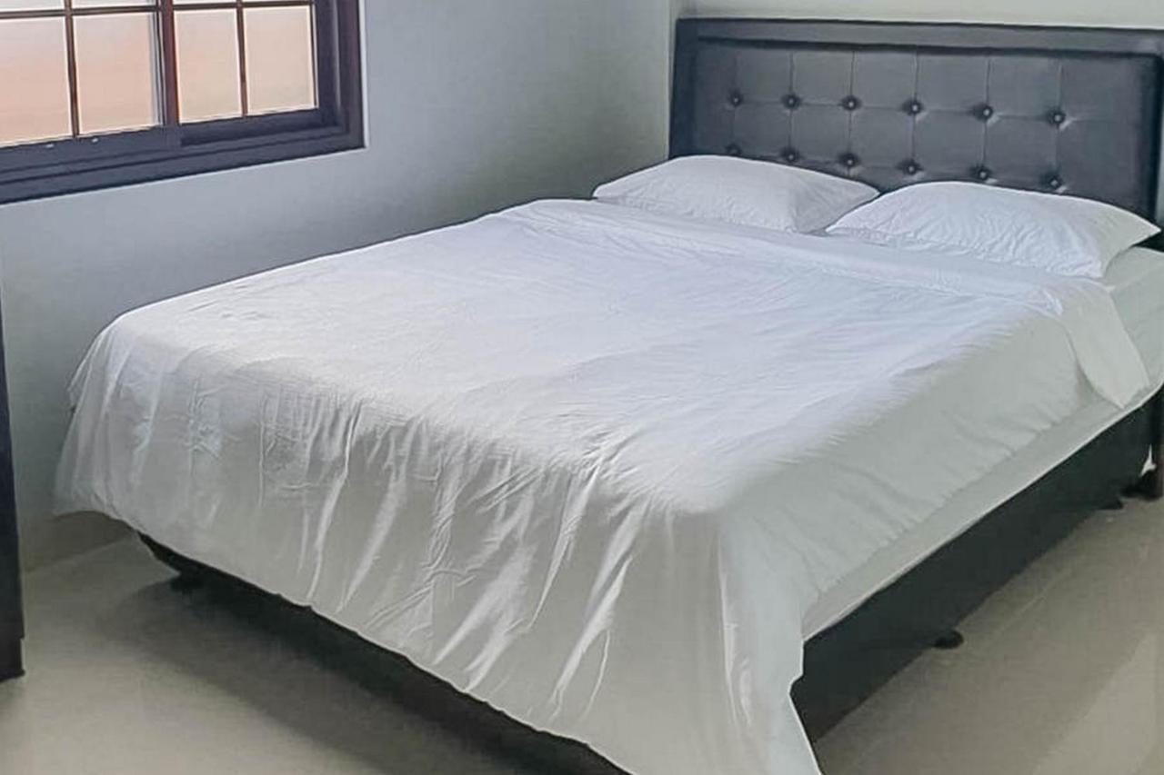 Mahkota Residence Mitra Reddoorz การาวัง ภายนอก รูปภาพ